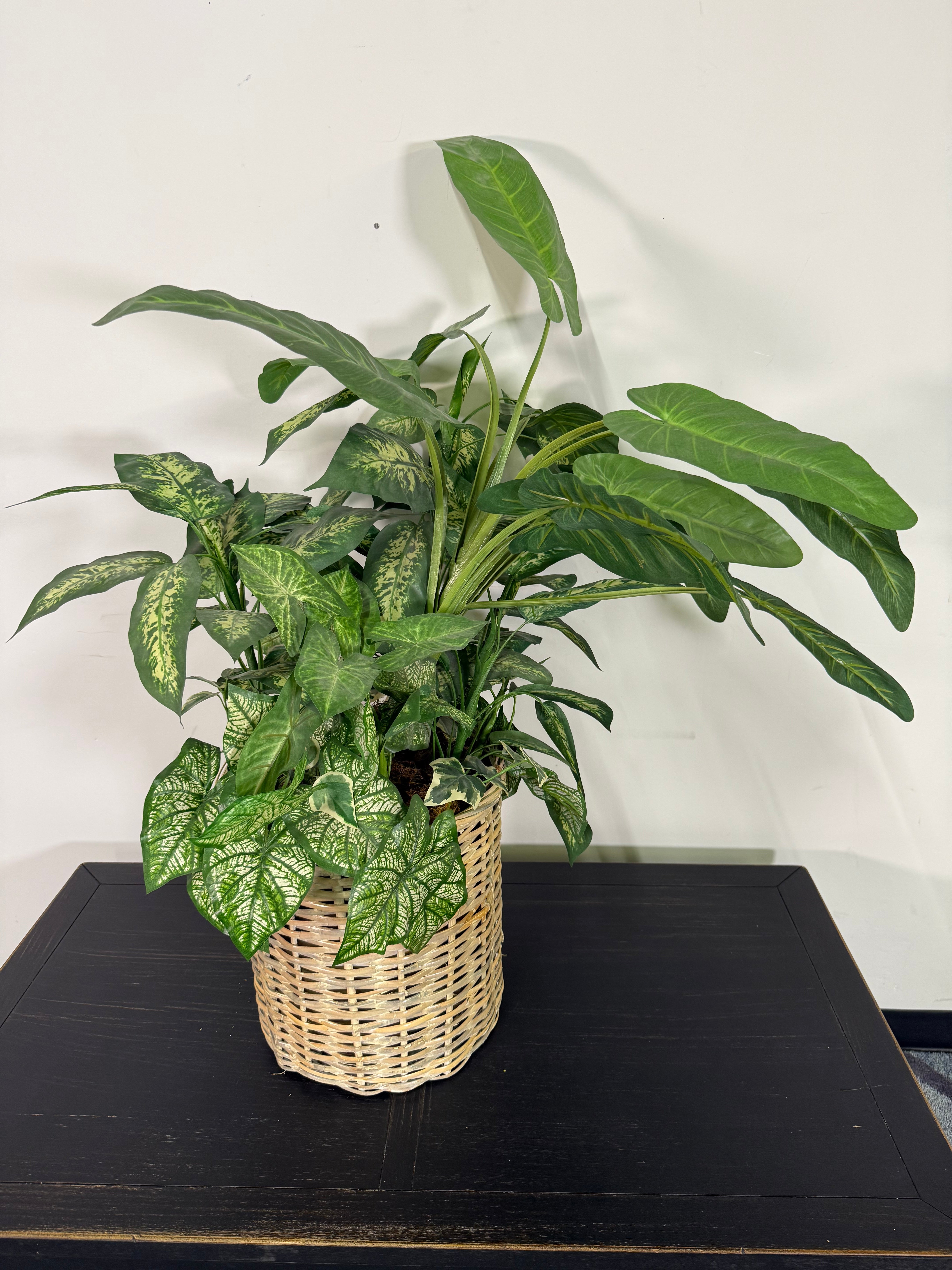 Lush Mixed Greenery Arrangement in Woven Basket